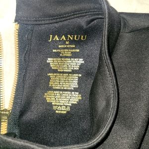 Jaanuu black scrub set with mock neck.